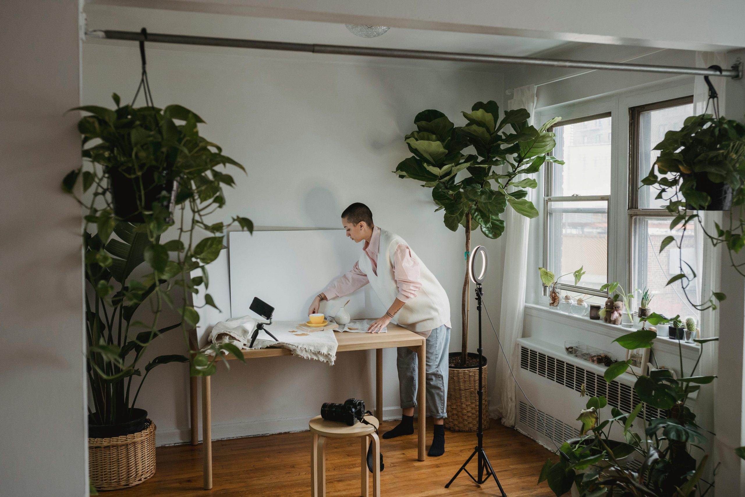 Integrating plants improves air quality and adds freshness to interiors. Vertical gardens or strategically placed potted plants work well even in compact spaces.